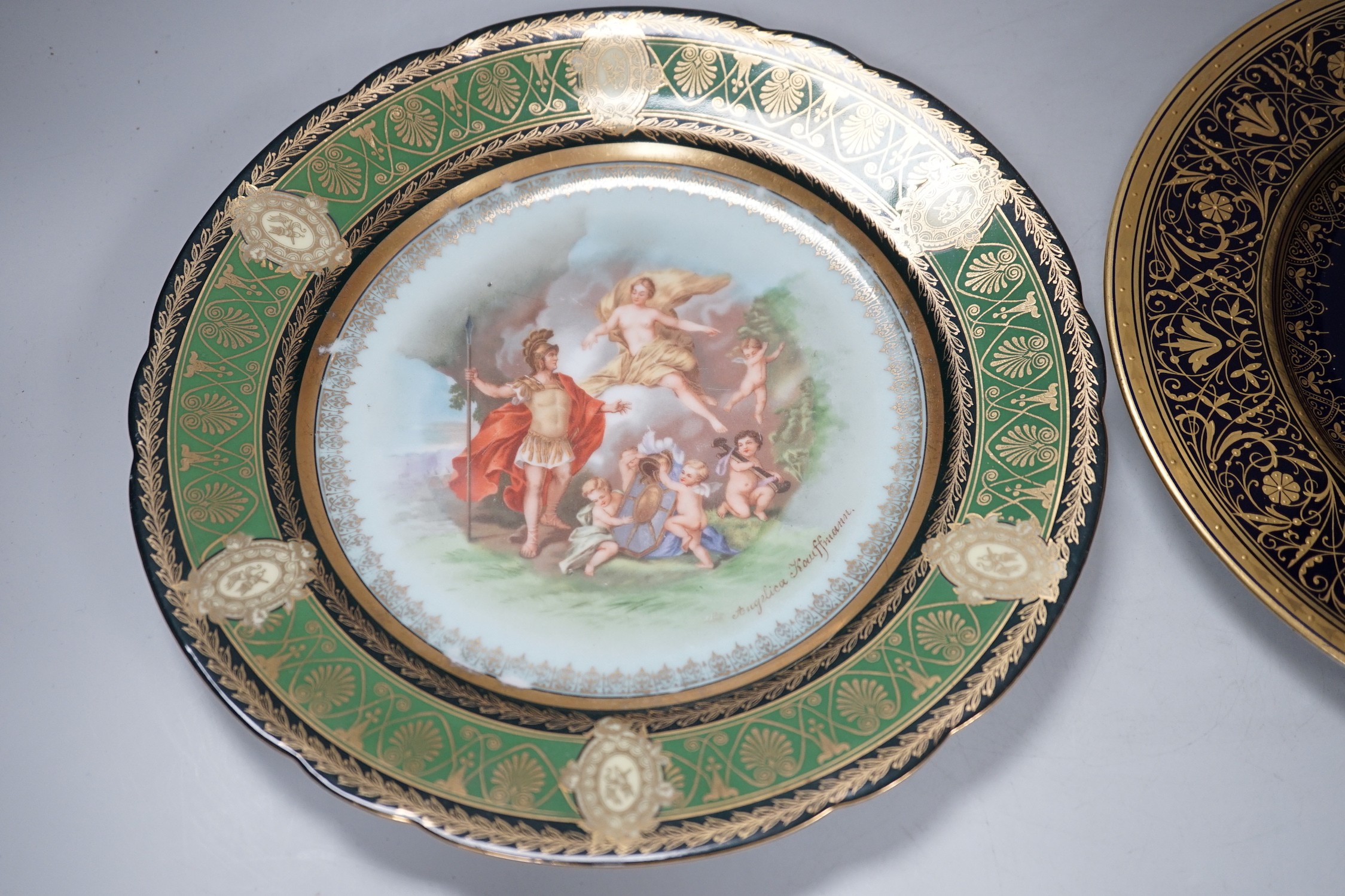 A Vienna style painted portrait plate, and another Vienna style plate both signed, largest 25cm diameter